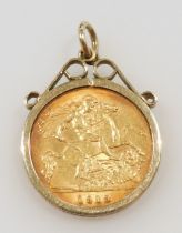 A George V 1913 gold half sovereign, in 9ct gold spring frame, 5.3g all in.