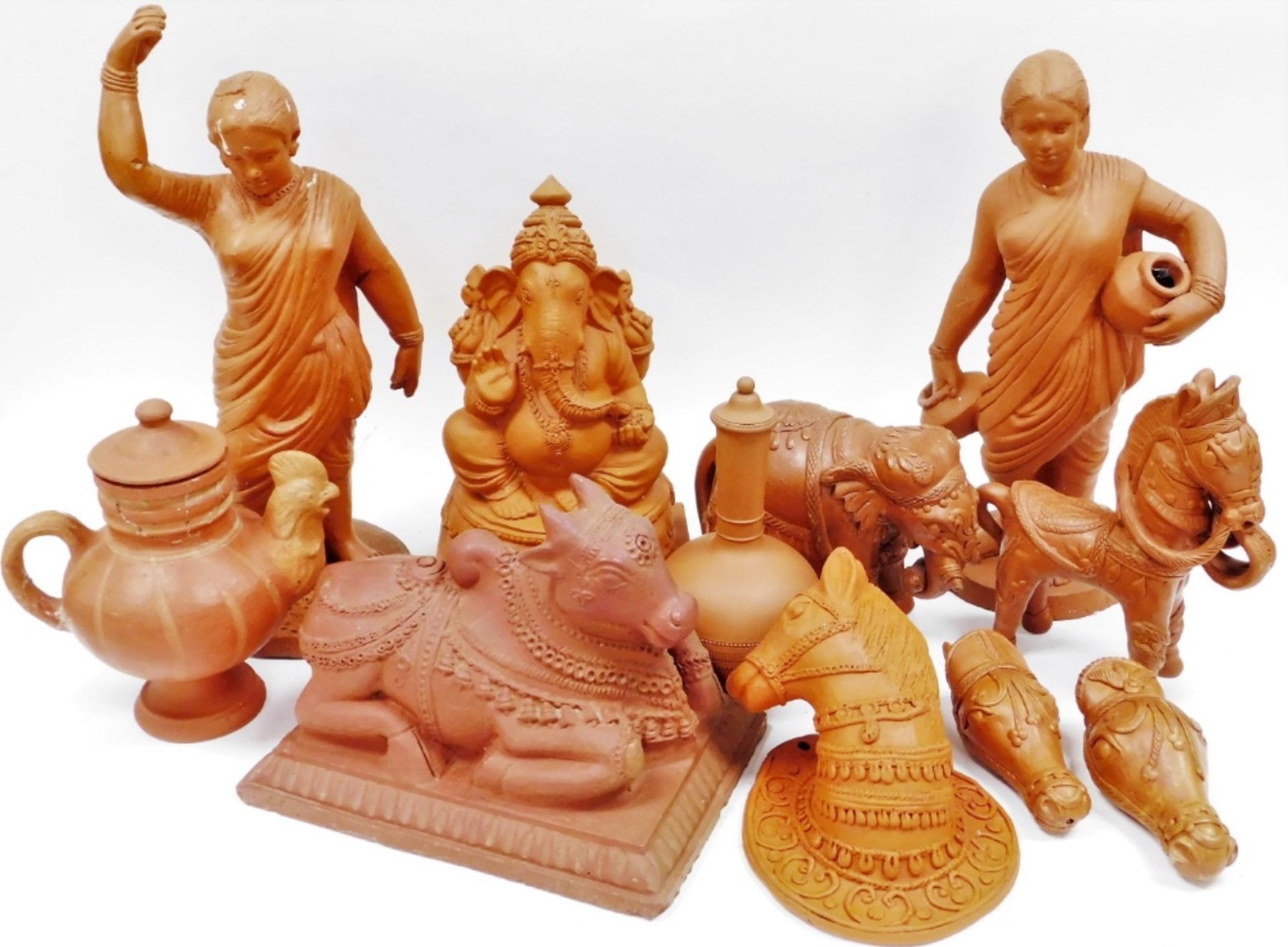 A group of Indian terracotta figures and tablewares, including Hindu deities and animals, and a cock
