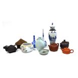 A group of Chinese ceramics, including red ware and terracotta teapots, blue and white vase and cove