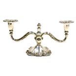 A Danish white metal candelabrum, with embossed scroll decoration to sconces and base, stamped 830 C