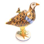 A Continental faience pottery tureen and cover, modelled in the form of a partridge, signed to under