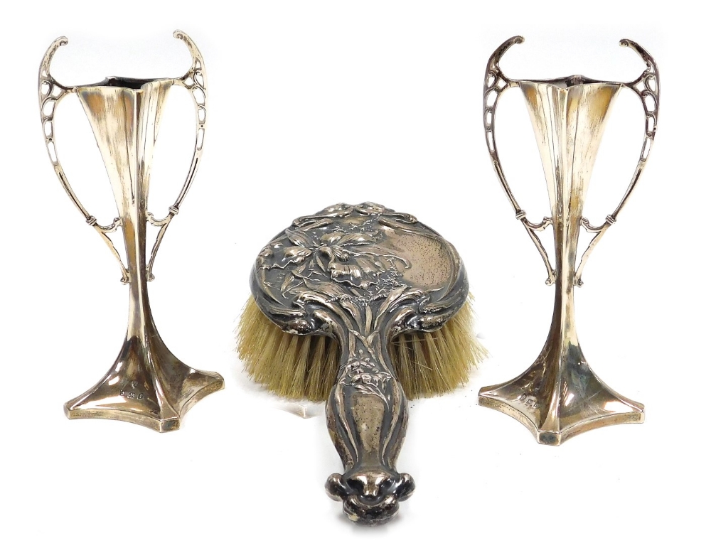 A pair of Edward VII Art Nouveau silver bud vases, of twin handled waisted form, loaded, Williams (B