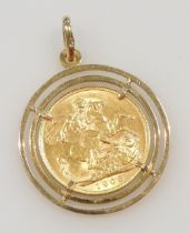An Edward VII 1908 gold full sovereign, in a 9ct gold mount, 10.5g all in.