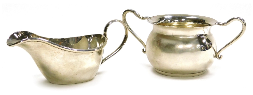 A Victorian silver two handled sugar bowl, of cauldron form, James Deakin & Sons (John & William F D