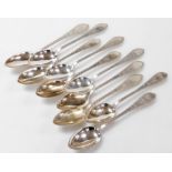 A set of ten Meyer Danish silver dessert spoons, foliate engraved, shield reserve monogram engraved,
