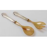 A pair of Christian Heise Danish horn and silver handled salad servers.