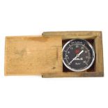 A Redex tyre pressure gauge, metal cased, Chiswick London, in a wooden outer box.