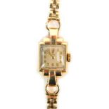 A 9ct gold Tudor lady's wristwatch, with a rectangular silver coloured numeric watch head, 1.2cm x 1