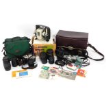 A quantity of camera equipment, comprising a Canon FX camera, 50mm lens, number 273985, Olympus Muju
