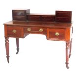 An early Victorian mahogany writing table, the raised back with an arrangement of six drawers, each