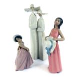 Three Lladro figures, comprising a figure group of two nuns, in white matt finish, 34cm high, a figu