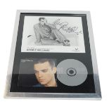 A Track Attach Robbie Williams signed photocard 1997, together with a CD of Angels, framed and glaze