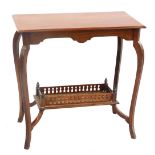 An Edwardian mahogany two tier table, the rectangular top with a moulded edge, on shaped supports wi