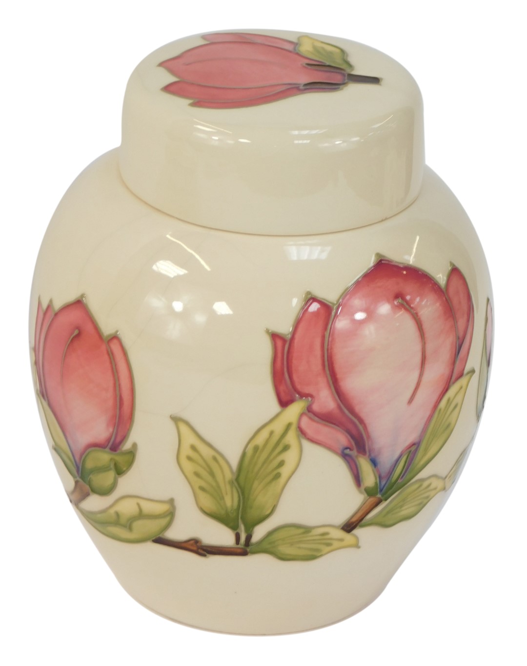 A Moorcroft Magnolia pattern ivory ground jar and cover, with green Moorcroft stamp and WM to unders