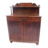 A William IV mahogany chiffonier, with scroll back and shelf, two door base, on turned feet, 104cm w