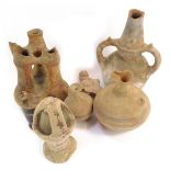 Various early Roman vases and other decorative pottery items.