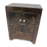 An Oriental lacquer collector's cabinet, with two doors, 84cm high, 64cm wide.