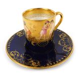 A 19thC Vienna porcelain demi-tasse coffee cup and saucer, painted by Kramer with children in pastor