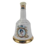 A Bell's commemorative pottery Scotch whisky decanter, To Commemorate the 60th Birthday of Her Majes
