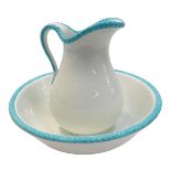 An early 20thC Wedgwood pottery wash jug and bowl set, on a white ceramic ground with turquoise ribb