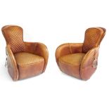A pair of brown leather saddle shaped armchairs, possibly Timothy Oulton, with stitched back and sea
