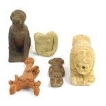 Various Middle Eastern pottery figures, including a carved marble recumbent lion, 19cm.