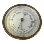 An early 20thC brass cased circular barometer, with silvered dial, 13cm diameter.