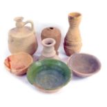 A collection of earthenware vases and bottles.