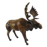 A leather bound model of a Moose, brown body and glass eyes, retailed by Liberty's 45cm high, 46cm w