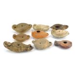 A collection of Roman pottery oil lamps. (9)