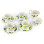 An Adams Micratex Fieldrow pattern part tea service, comprising four tea cups and saucers, sugar bow