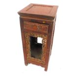 An Oriental lacquer pedestal stand, with carved panel sides, 92cm high, 42cm square.