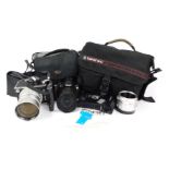 A group of camera and optics equipment, comprising Minolta spot meter F, Nikon D60 camera, with Niko