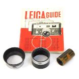 A Leica Reloadable cassette, 50mm lens hood, and a Leica guide book. (3)