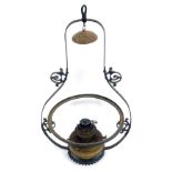 A 19thC cast iron hanging oil lamp, on a shaped and fluted base, with oil lamp fitment, 90cm high.