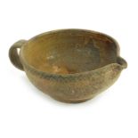 A small Roman pottery shallow jug, with painted decoration, 13cm diameter.