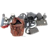 Camera and optics equipment, comprising flashes, a Minolta Dynax 3000I camera, Kodak box cameras, an