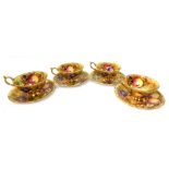 A set of four Aynsley Orchard Gold pattern tea cups and saucers, each painted with fruit by D Jones,