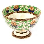 A Royal Doulton pottery pedestal fruit bowl, printed with flowers and stylised leaved, printed mark,