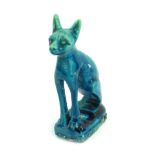 A small Egyptian turquoise glazed cat figure, 9cm high. (AF)