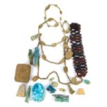 A small collection of beads, figurines, turquoise pottery scarab, and other antiquities and artefact