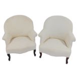 A matched pair of spoonback upholstered armchairs, on cabriole legs.