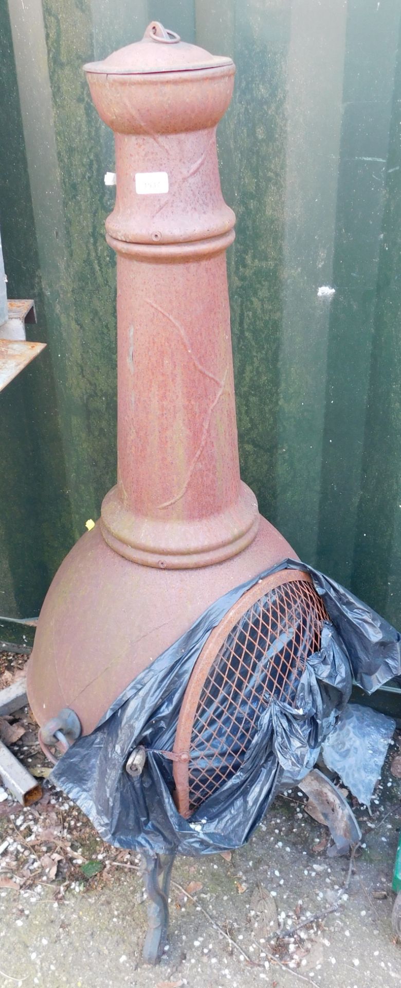 A cast iron garden chiminea.