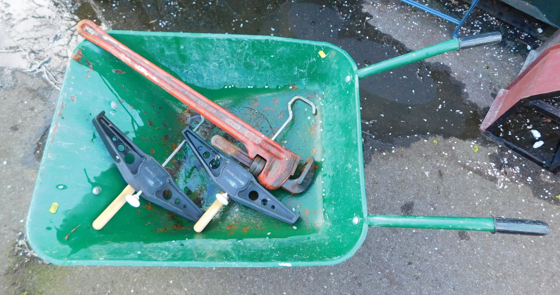 A green wheelbarrow, tools, etc. (a quantity) Note: VAT is payable on the hammer price of this lot a