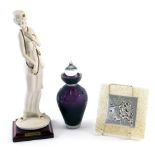 An amethyst and clear glass perfume bottle with stopper, an Armani figure, and a Cortellani plaque o