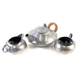 An early 20thC Archibald Knox design English Pewter three piece tea service, comprising teapot of sq