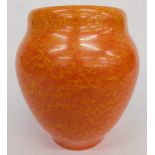 A Royal Lancastrian pottery orange vase, by Radford, vibrantly decorated with a speckle glaze, on ci