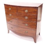 An early 19thC mahogany bow front chest of two short and three long graduated drawers, with oval pre