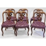 A set of six Victorian mahogany spoon back dining chairs, each with a pierced Gothic style quatrefoi