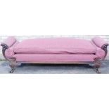 A 19thC style mahogany scroll arm sofa or day bed, with fruit carved show-frame, and scroll feet, do